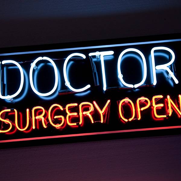 Neon light sign Doctor Surgery Open