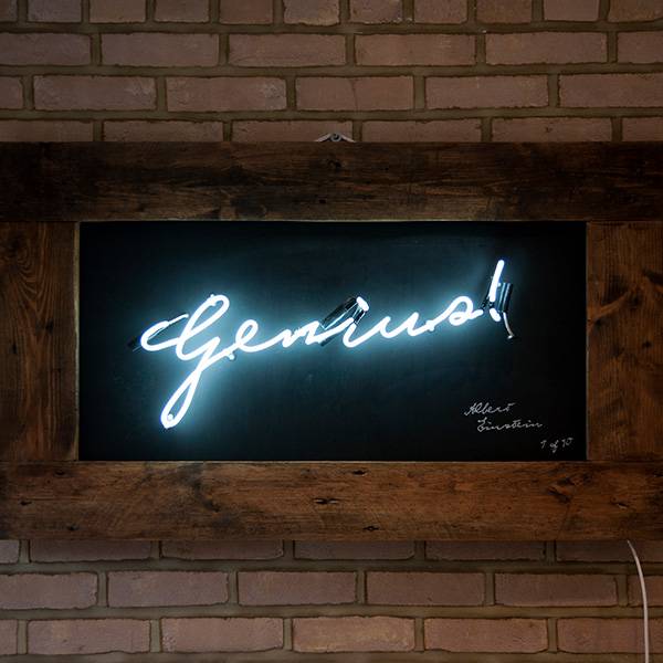Neon writing white genius