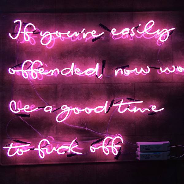 Neon light writing pink if youre easily offended