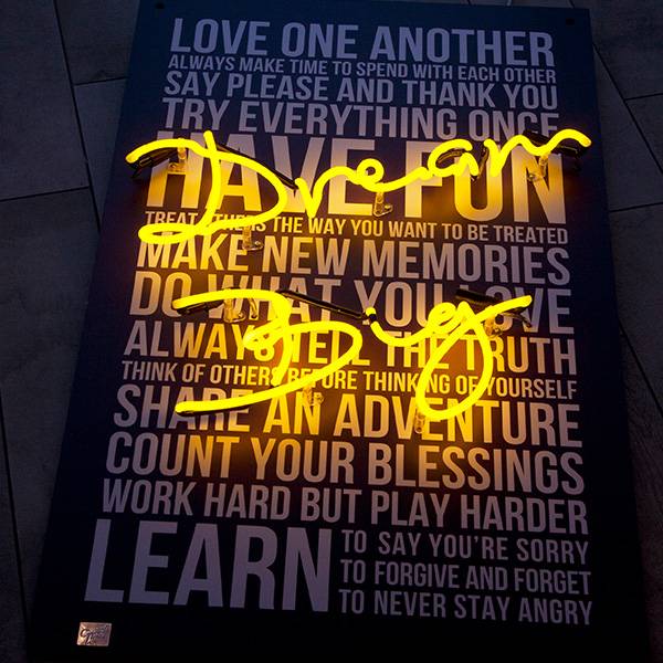 Neon light writing yellow dream big