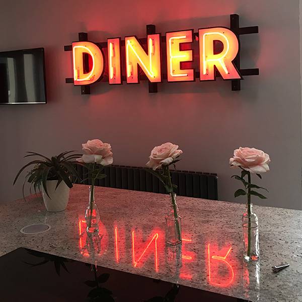 Vintage neon sign Diner orange