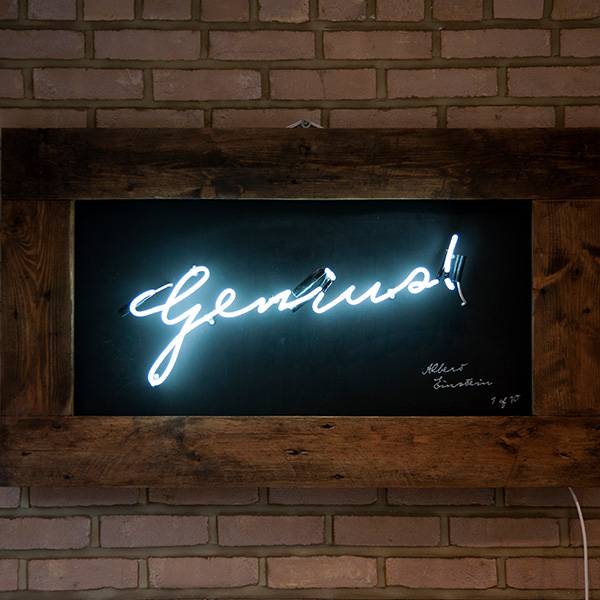 Neon writing white genius