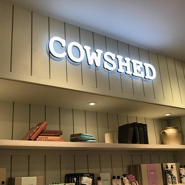 Ultra neon Cowshed logo blue