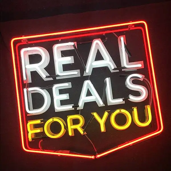 real deals traditional glass neon sign