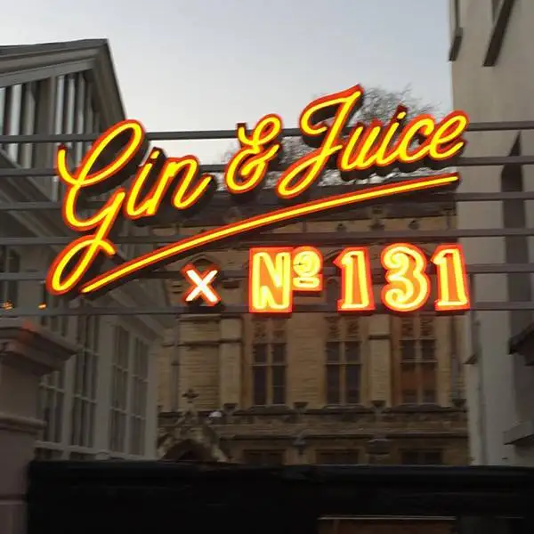 traditional real neon gin and juice sign