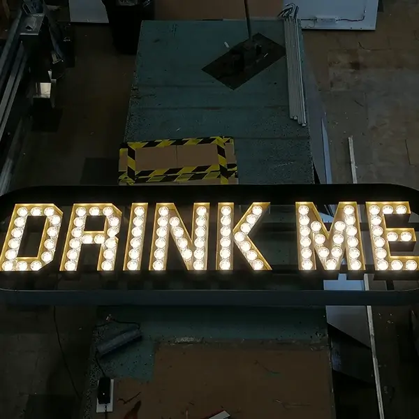 drink me bar signage