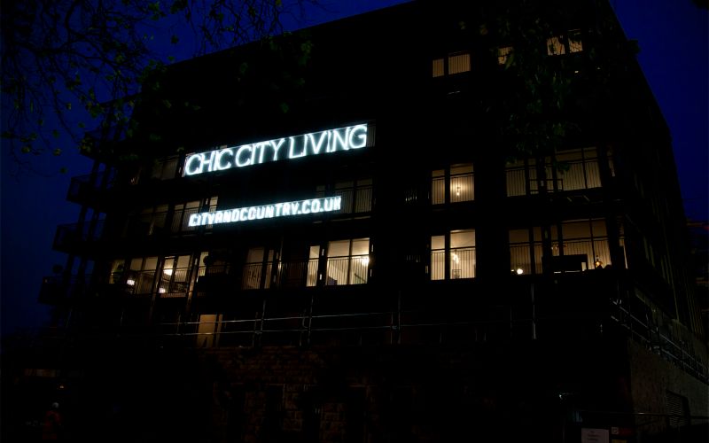 neon-sign-outside-chic-city-living-min