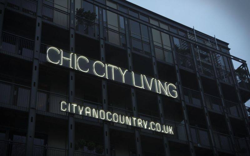neon-sign-outside-city-and-country-min